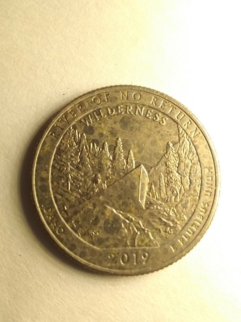 2019 San Antonio Missions quarter with missing clad layer exposing orange copper core