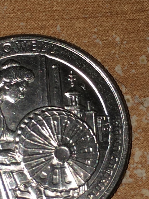 2019 Frank Church quarter die chip error showing raised blob near rim under raking light